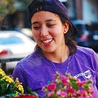Emily Feldman: girl wearing purple shirt and backwards hat