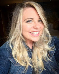 Virginia Rector, blonde woman smiling wearing denim jacket
