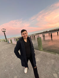 Greg Garcia; walking down the pier during sunset