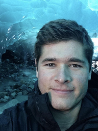 Mike smiling for a selfie at the aquarium 