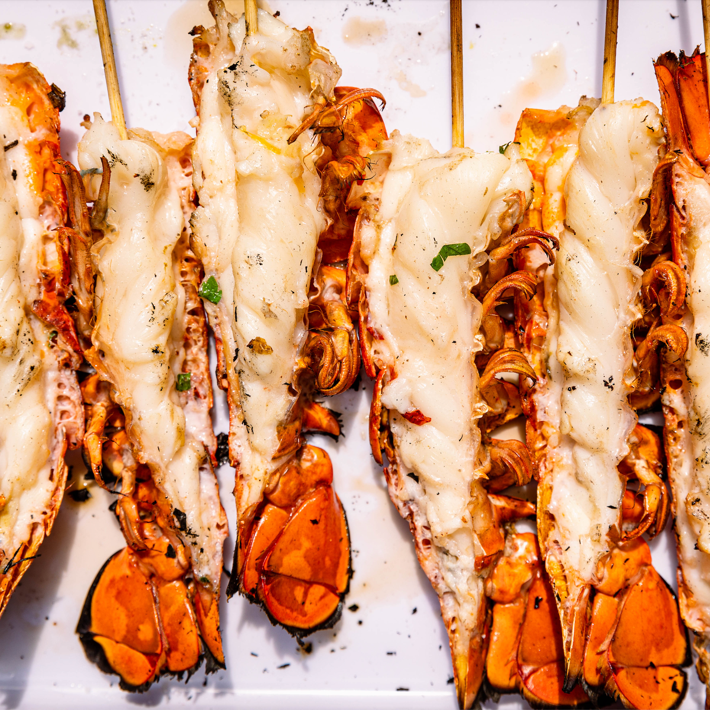 Load image into Gallery viewer, split lobster tails on platter
